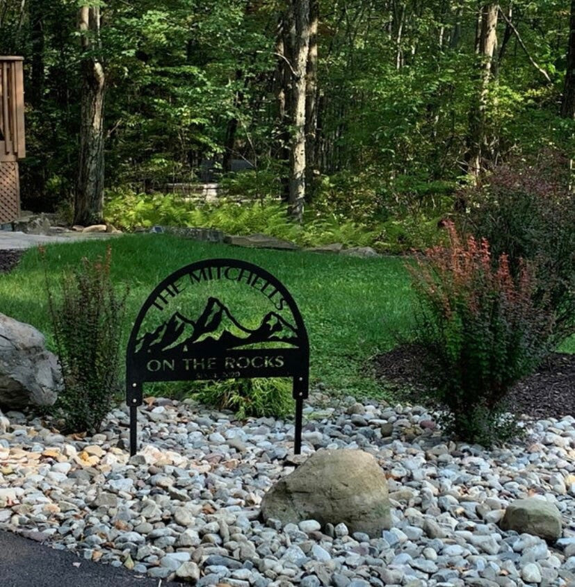 Metal mountain sign with TETON MOUNTAIN RETREAT