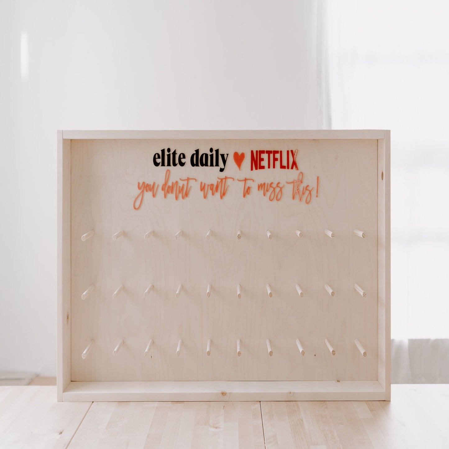 Donut Wall - Framed and Fully Customizable. Perfect for weddings, special events, and branding. 44" x 24" up to 80 donuts.