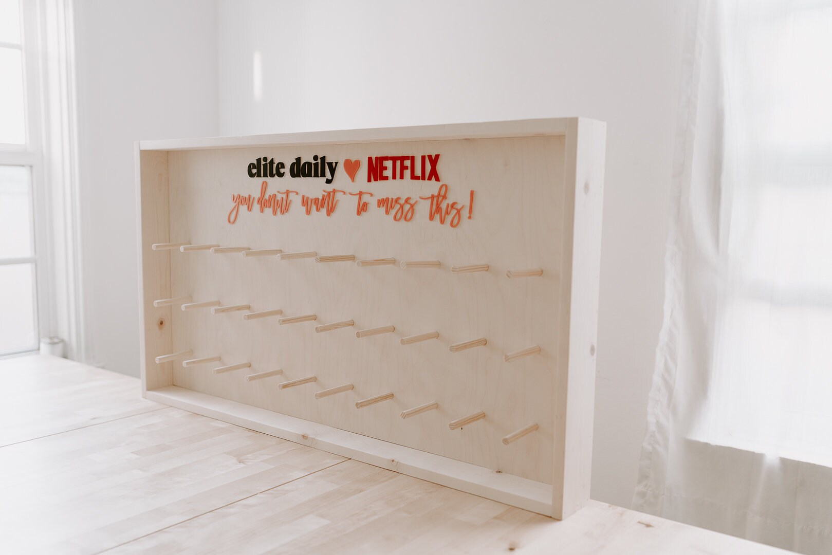 Donut Wall - Framed and Fully Customizable. Perfect for weddings, special events, and branding. 44" x 24" up to 80 donuts.